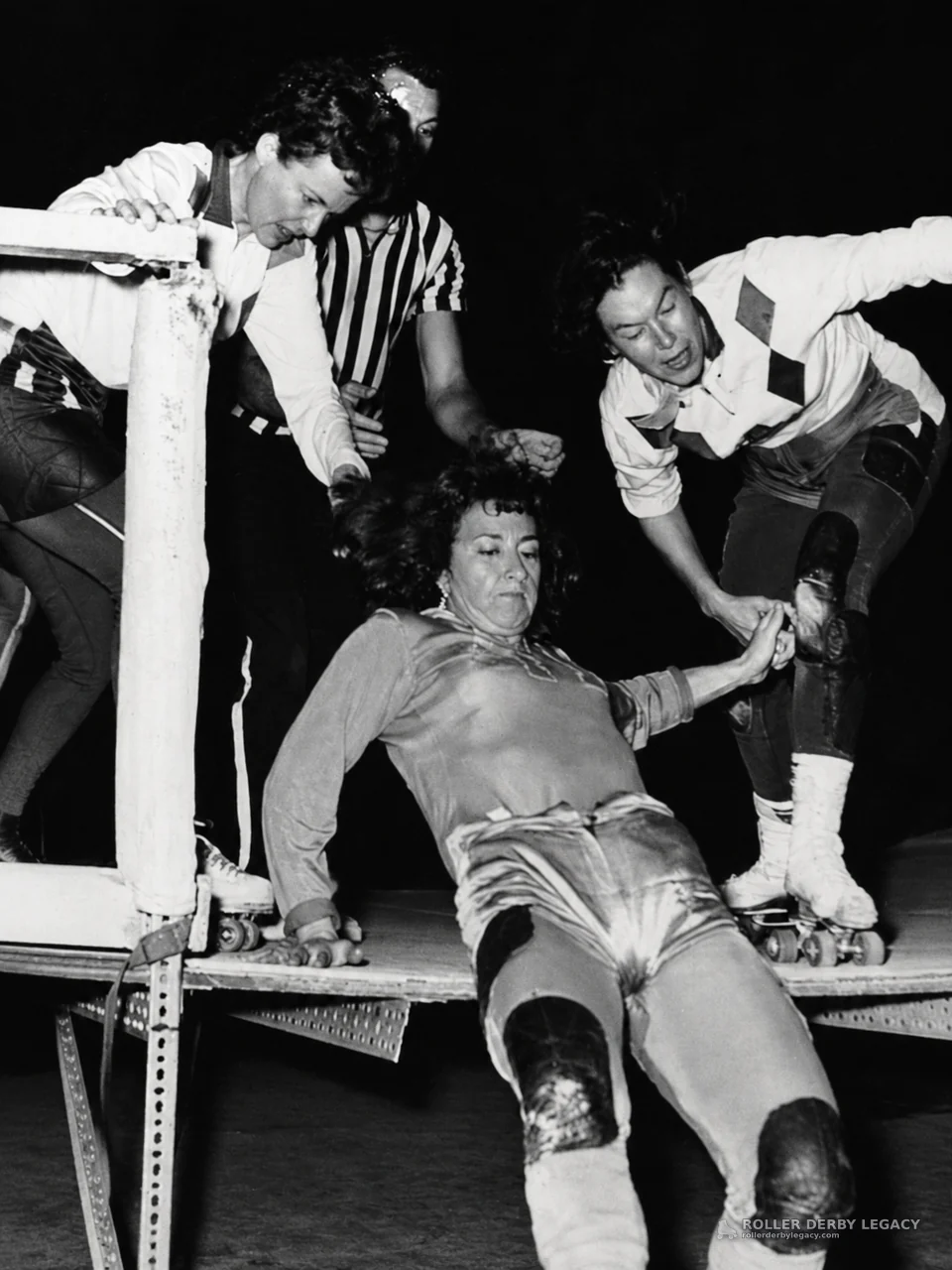 Fallen Roller Derby Skater Assisted Near Track Rail