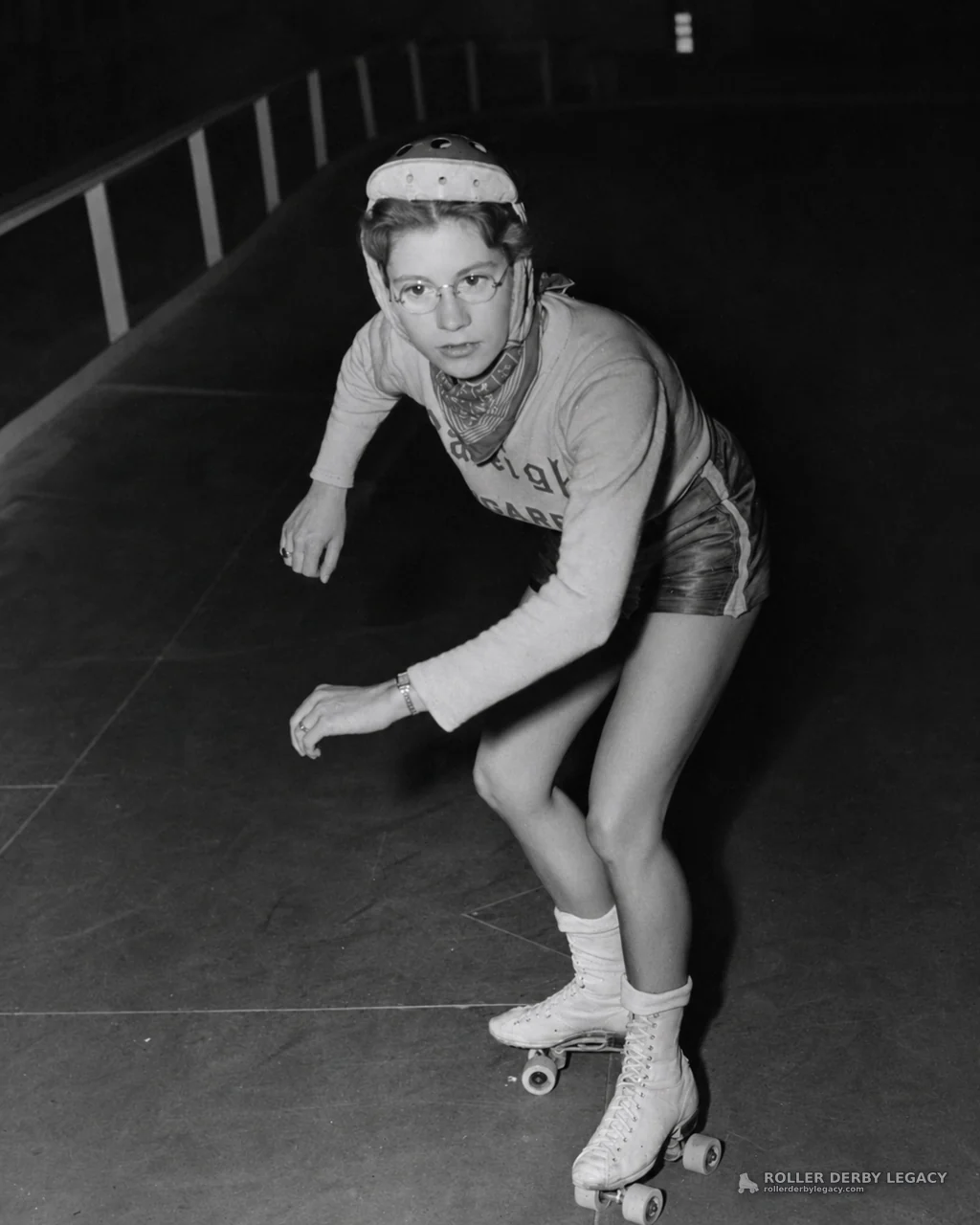 Helmeted Skater on an Indoor Track