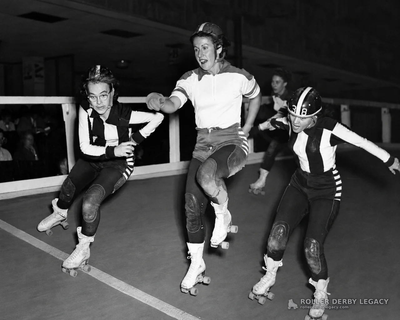 Roller Skaters Racing on an Indoor Track
