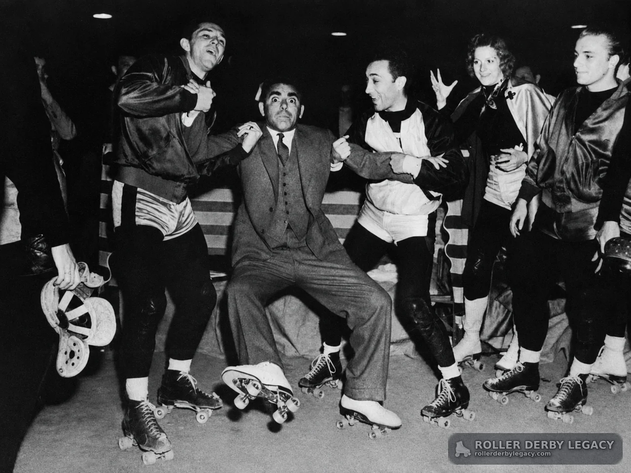 Roller Skaters Gather Around a Seated Man
