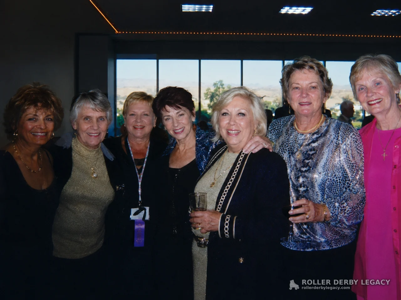 Seven Women at an Indoor Social Gathering