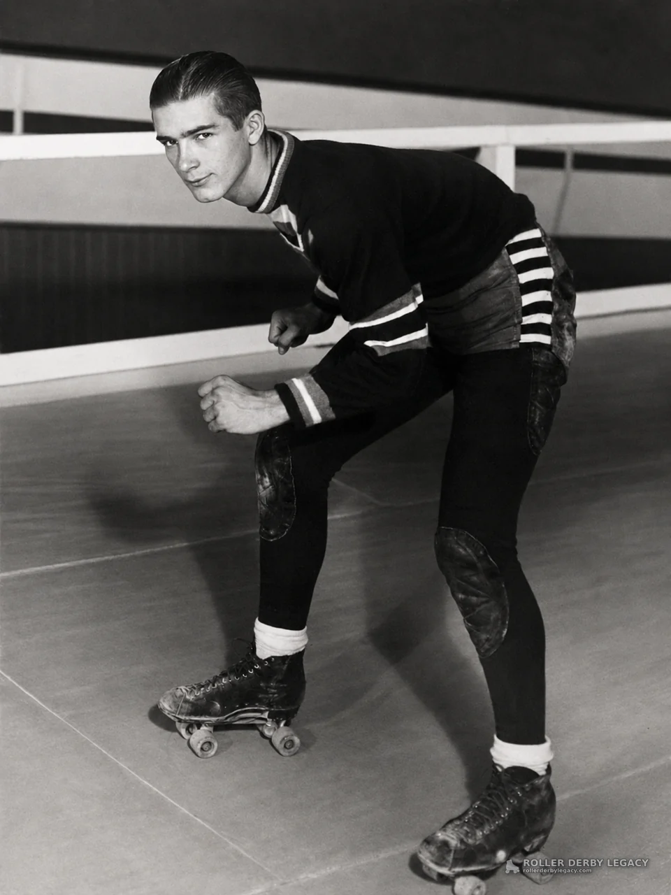 Skater in Crouched Stance at Indoor Roller Rink