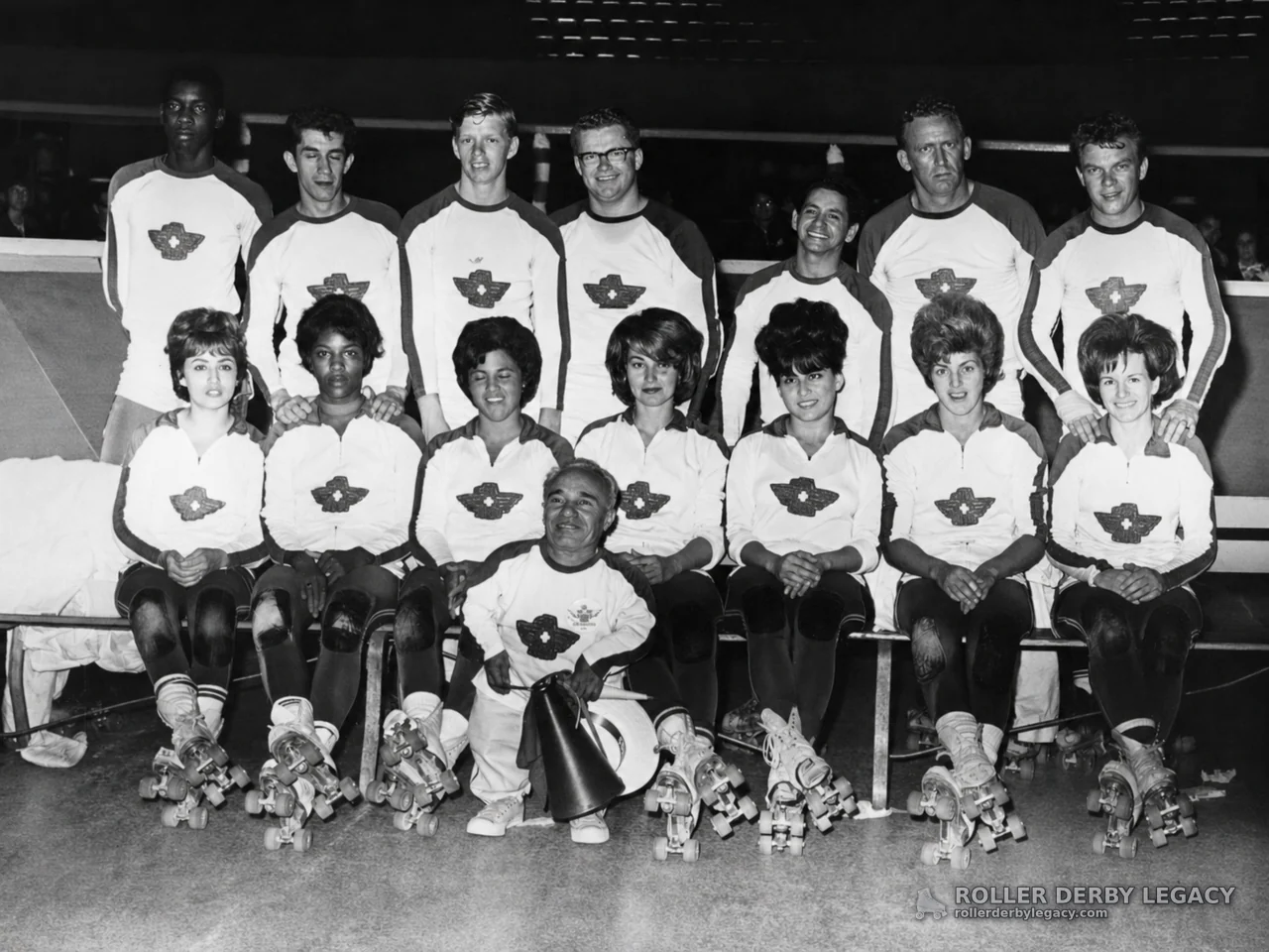 Roller Skaters Posed in Matching Uniforms with Megaphone