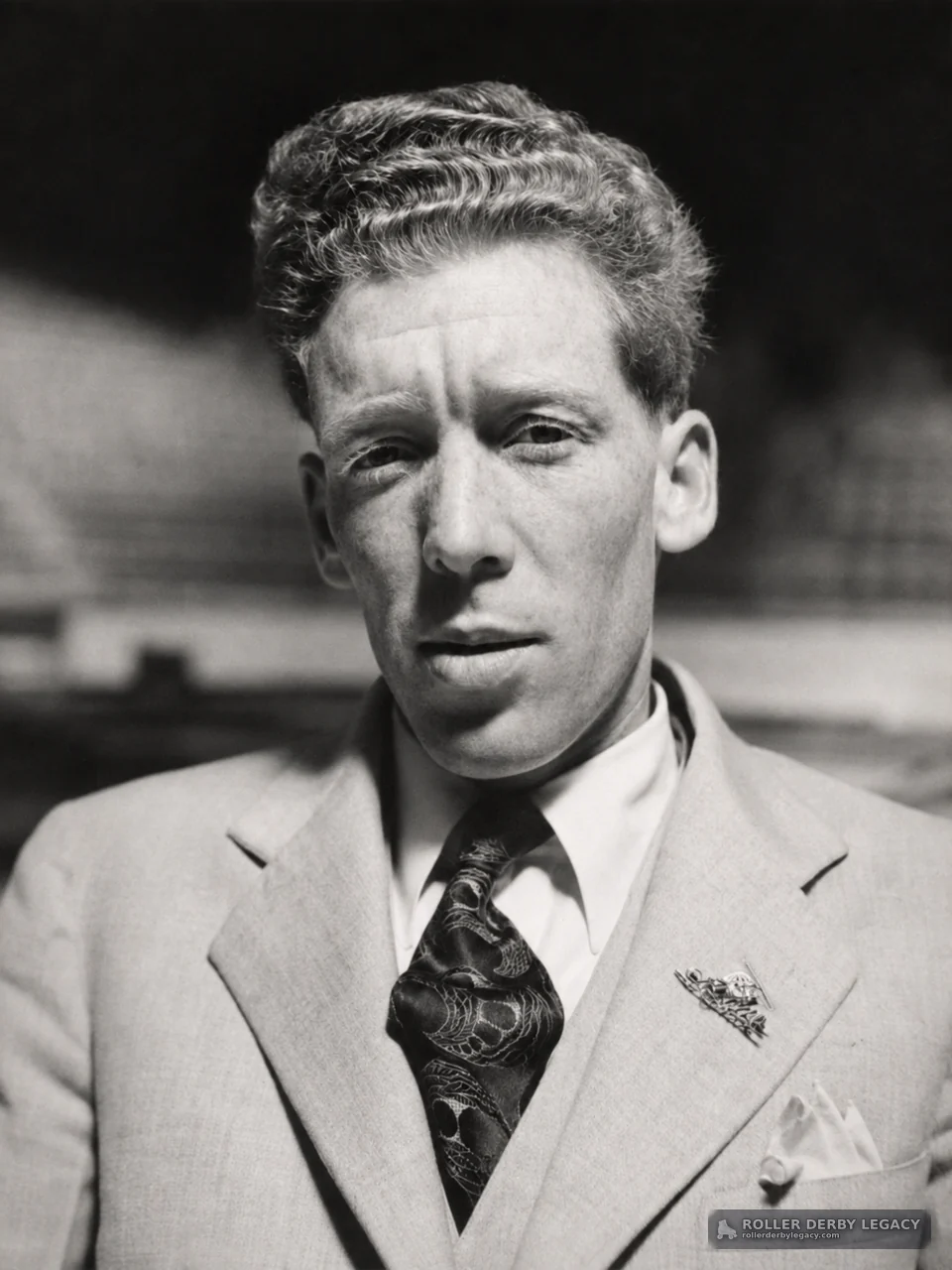 Black-and-White Portrait of Man in Light Suit