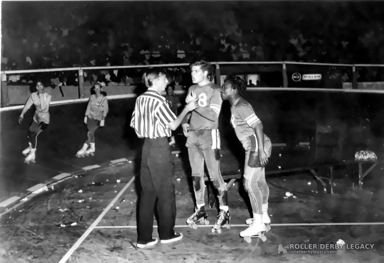 Official Speaks with Number 8 Roller Derby Skater