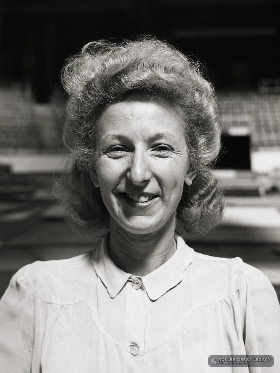 Portrait of a Smiling Woman in a Light Collared Blouse