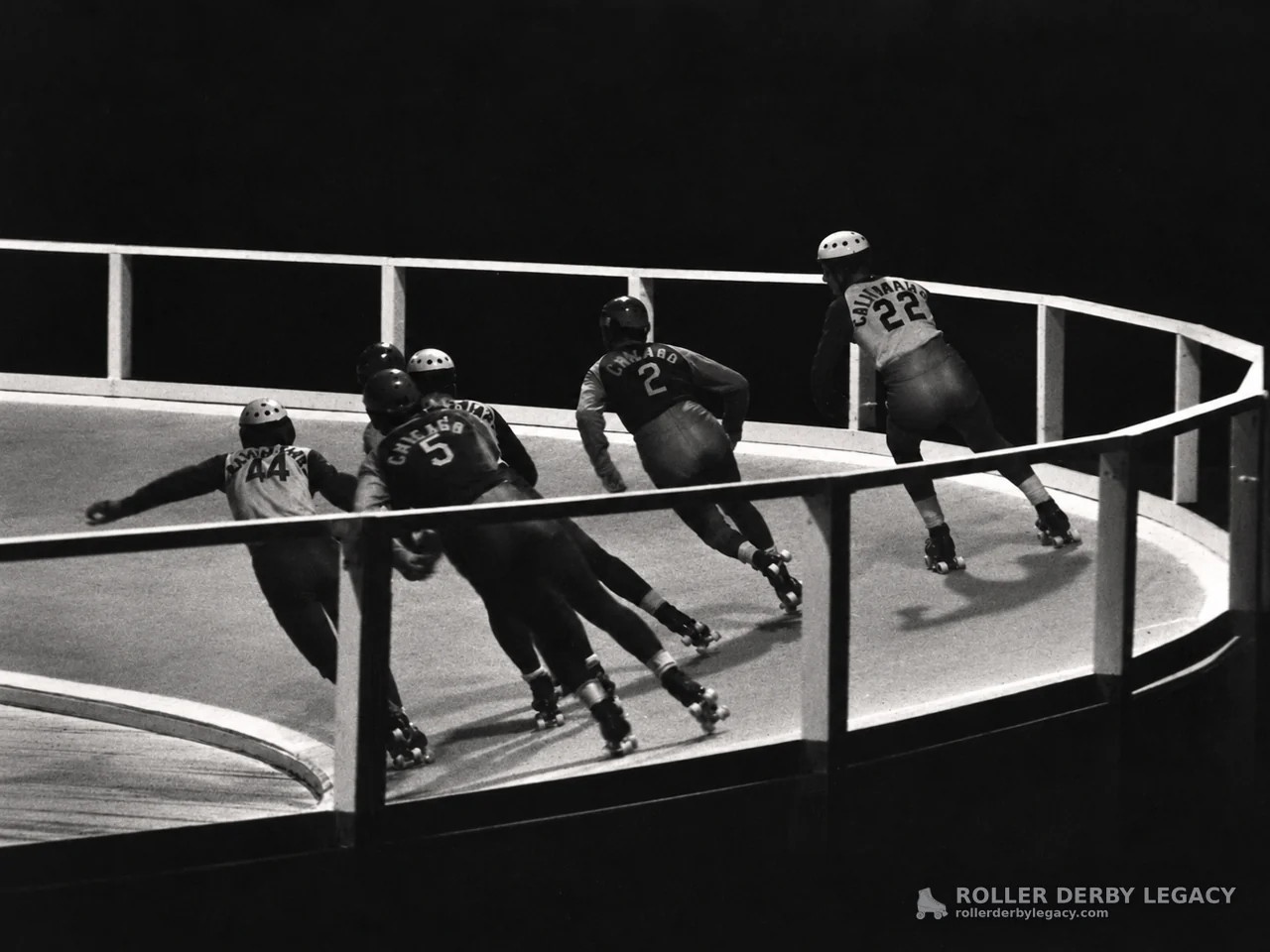 Skaters Rounding a Banked Roller Derby Track