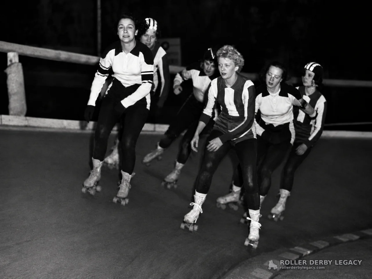 Six Skaters on a Curved Roller Derby Track