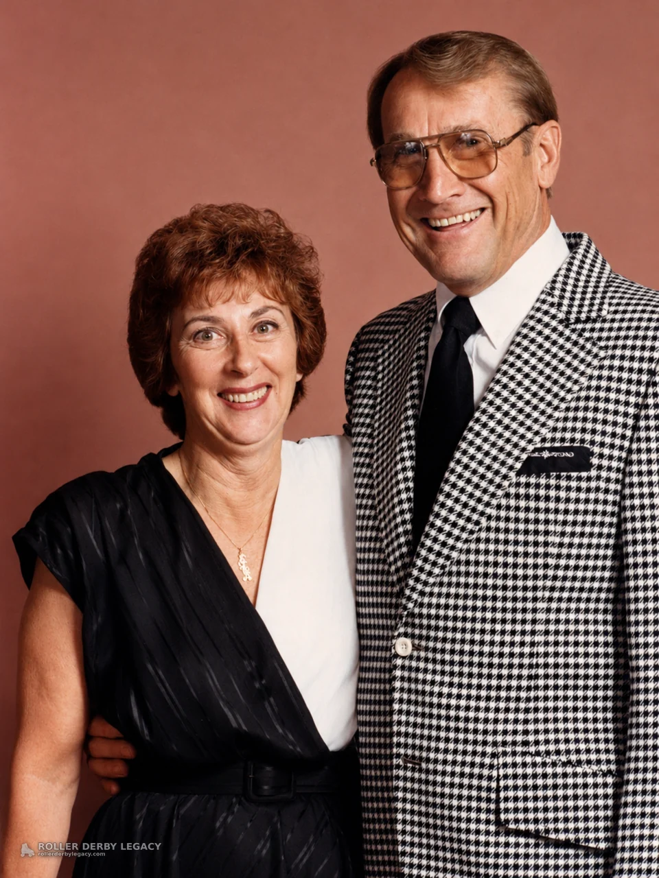 Studio Portrait of Two Smiling Adults