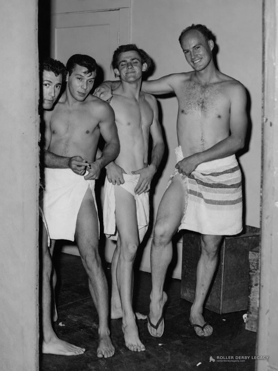 Unidentified Men in Towels in a Changing Room Doorway