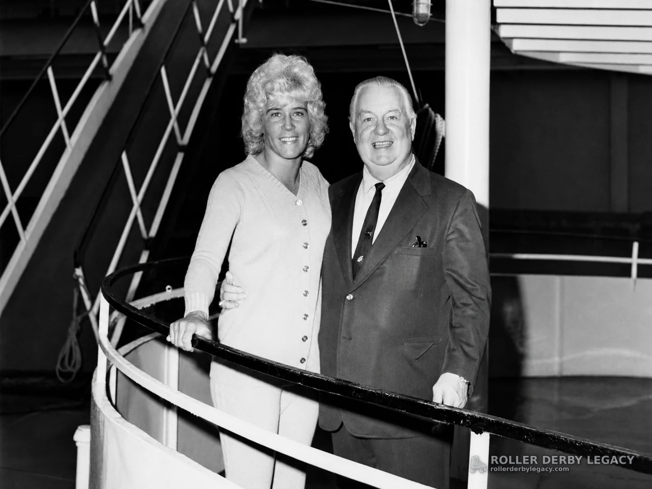 Unidentified Pair Posing by a Curved Railing