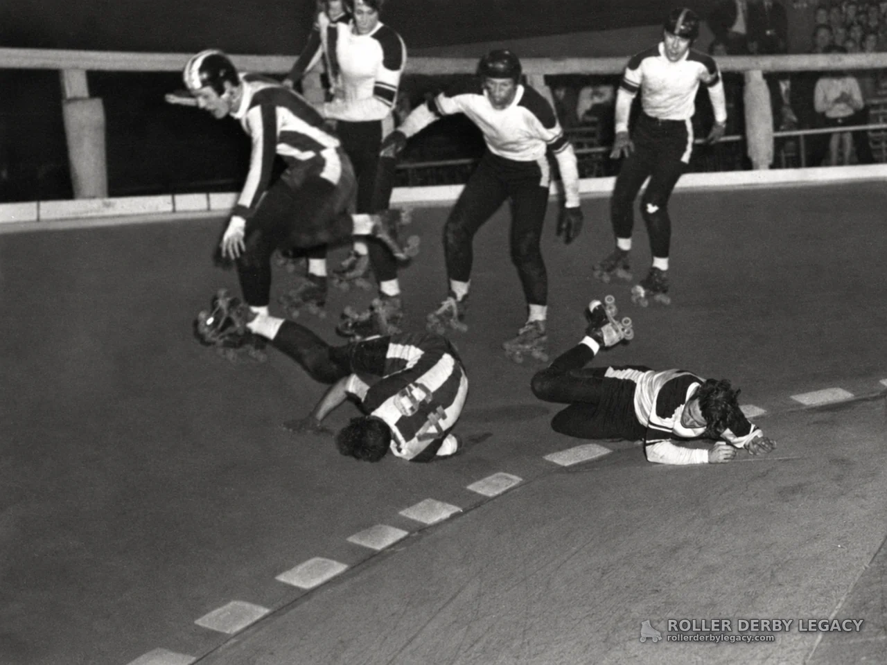 Roller Derby Skaters Fall on Indoor Track