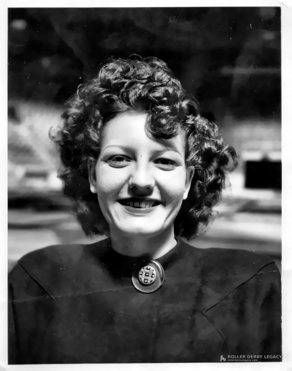 Smiling Woman in Black-and-White Portrait