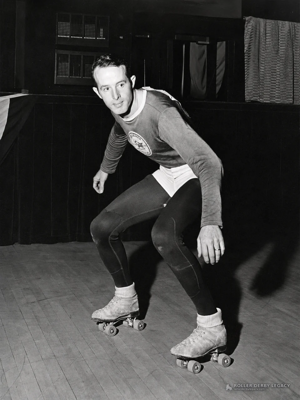 Skater Crouched on Quad Roller Skates Indoors
