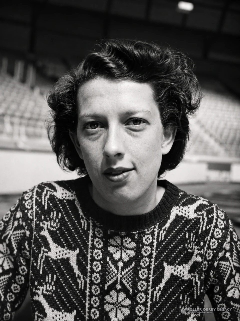 Portrait in Patterned Sweater at Indoor Arena