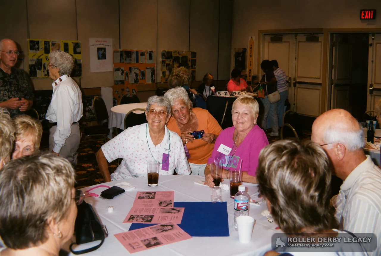 Group at Banquet Tables with Photo Displays