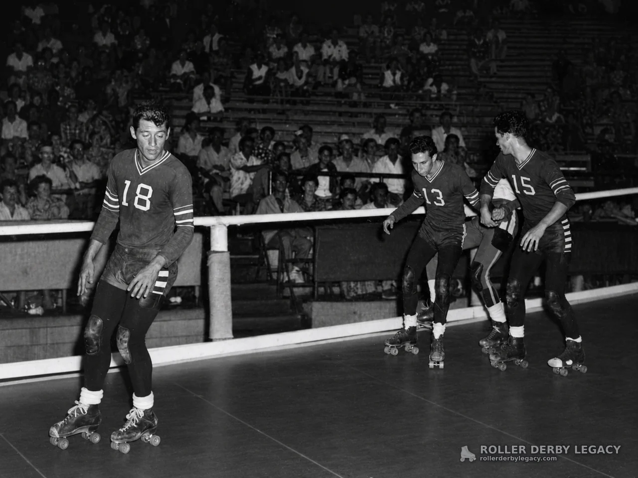 Numbered Roller Skaters on an Indoor Rink