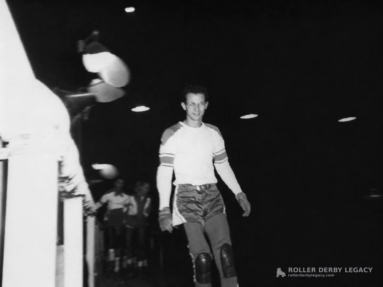 Skater in Protective Gear at an Indoor Arena