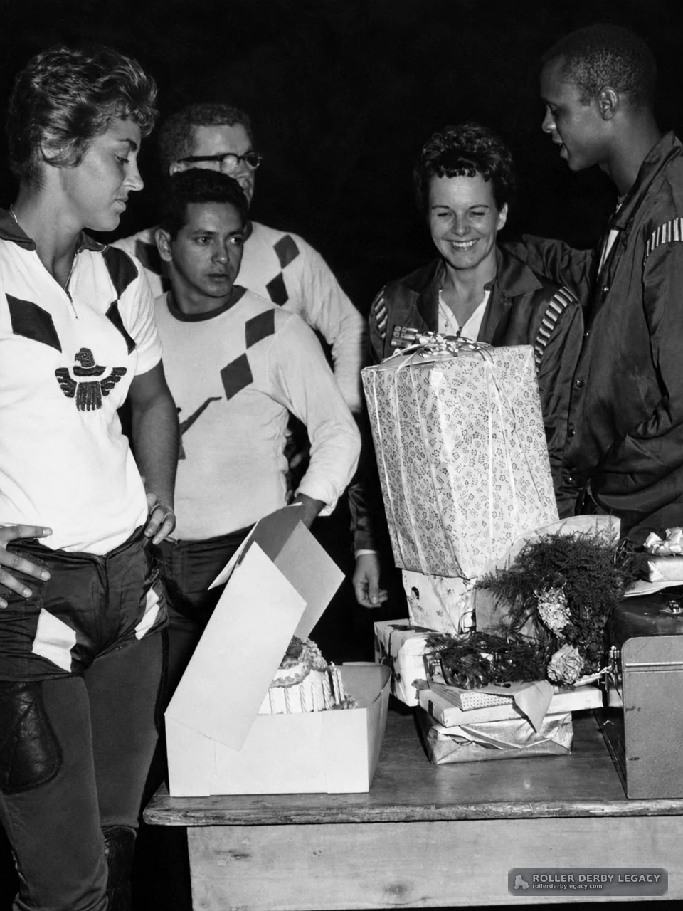 Group gathered around a table of gifts