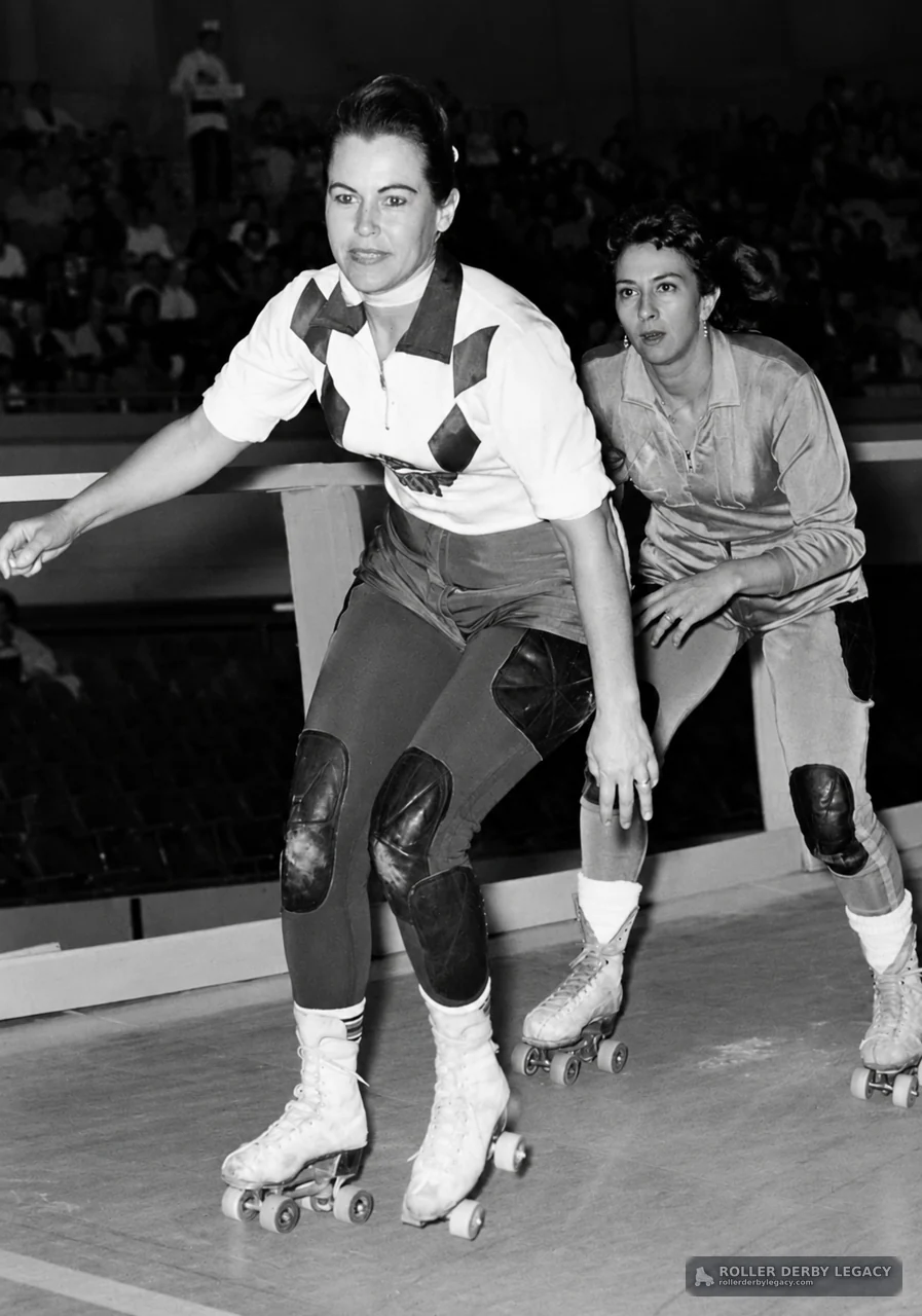 Two Roller Derby Skaters on an Indoor Rink