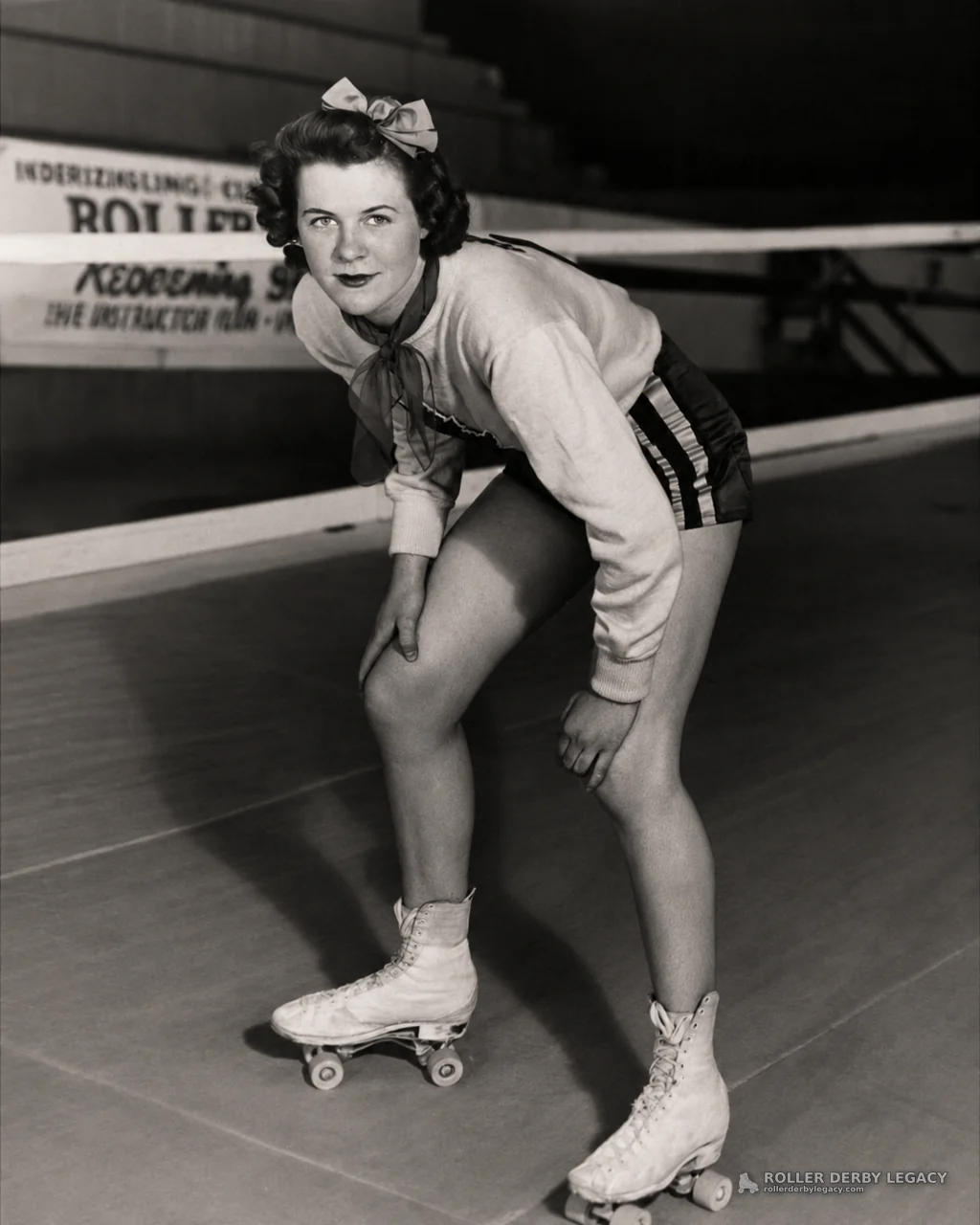 Unidentified Skater Crouching at Indoor Roller Rink