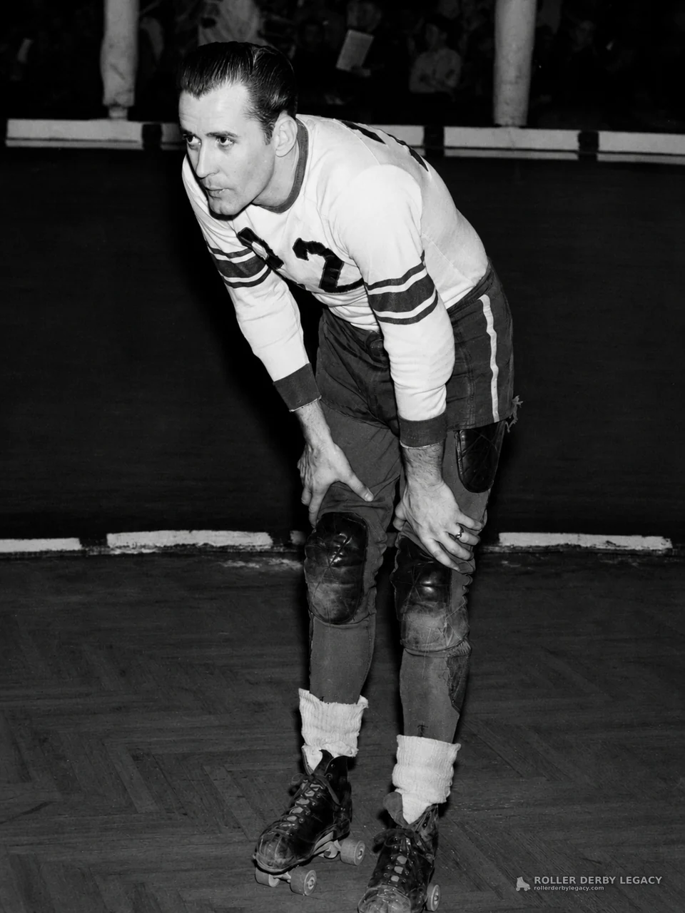 Skater Leaning Forward on an Indoor Roller Rink