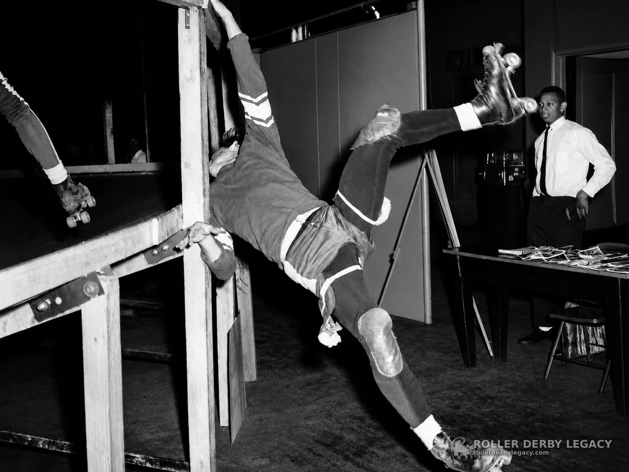 Skater Tumbling Over Track Barrier
