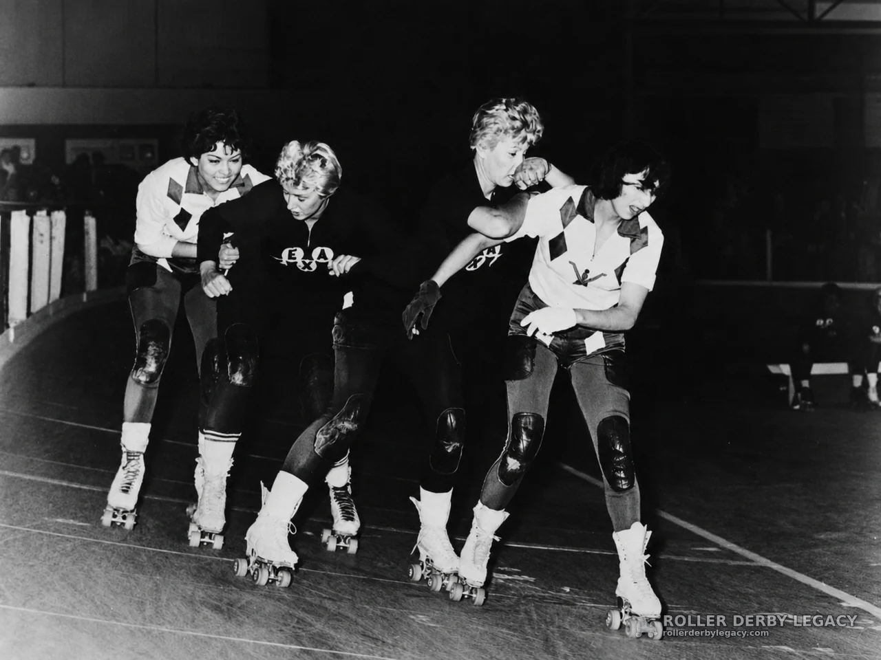 Four Skaters in Roller Derby Pack Action