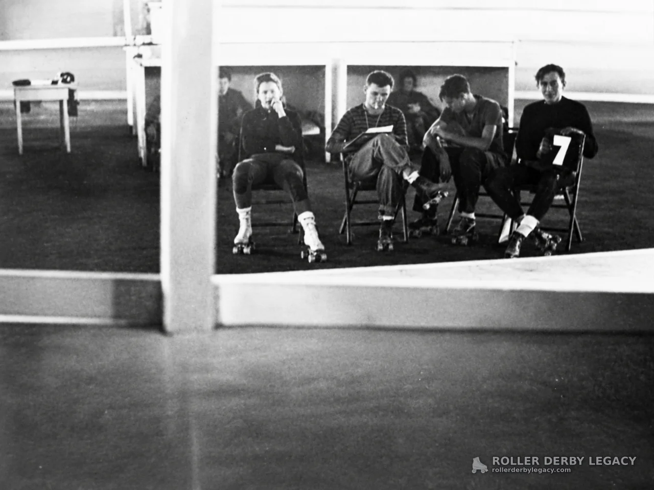 Seated Skaters with Number 7 Placard