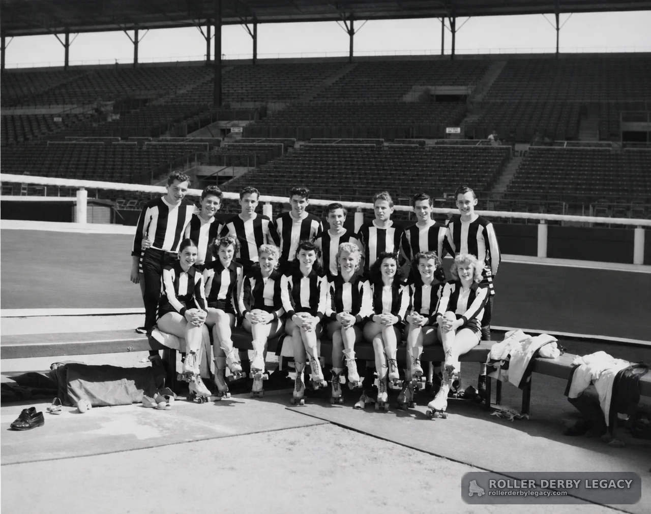Roller Skaters in Striped Uniforms Posing in an Arena