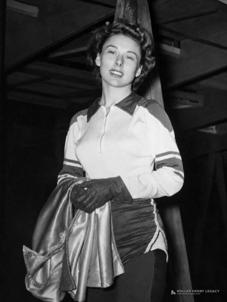 Unidentified Woman in Athletic Uniform Holding Shiny Garment
