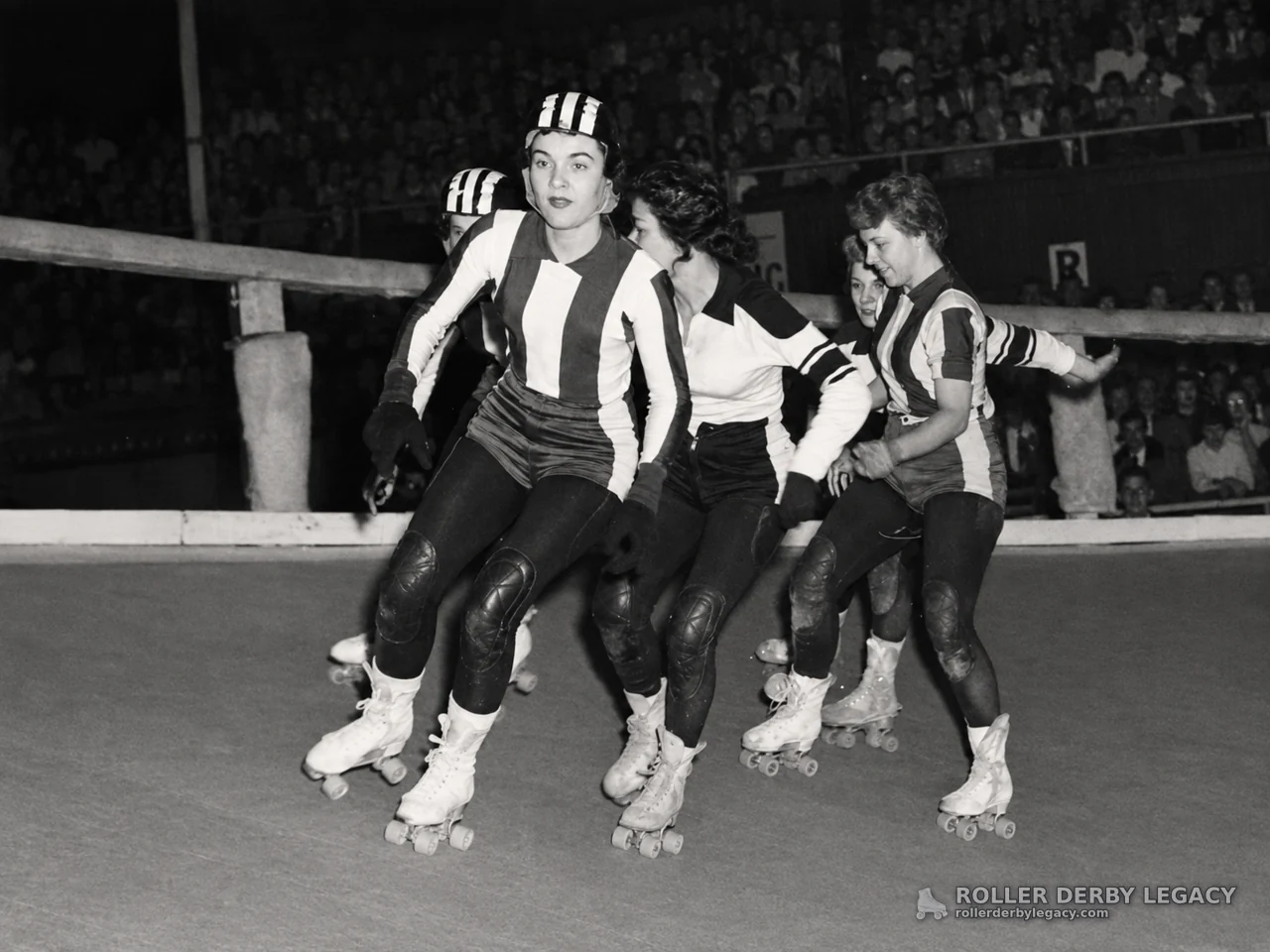 Striped-Uniform Skaters on an Indoor Rink
