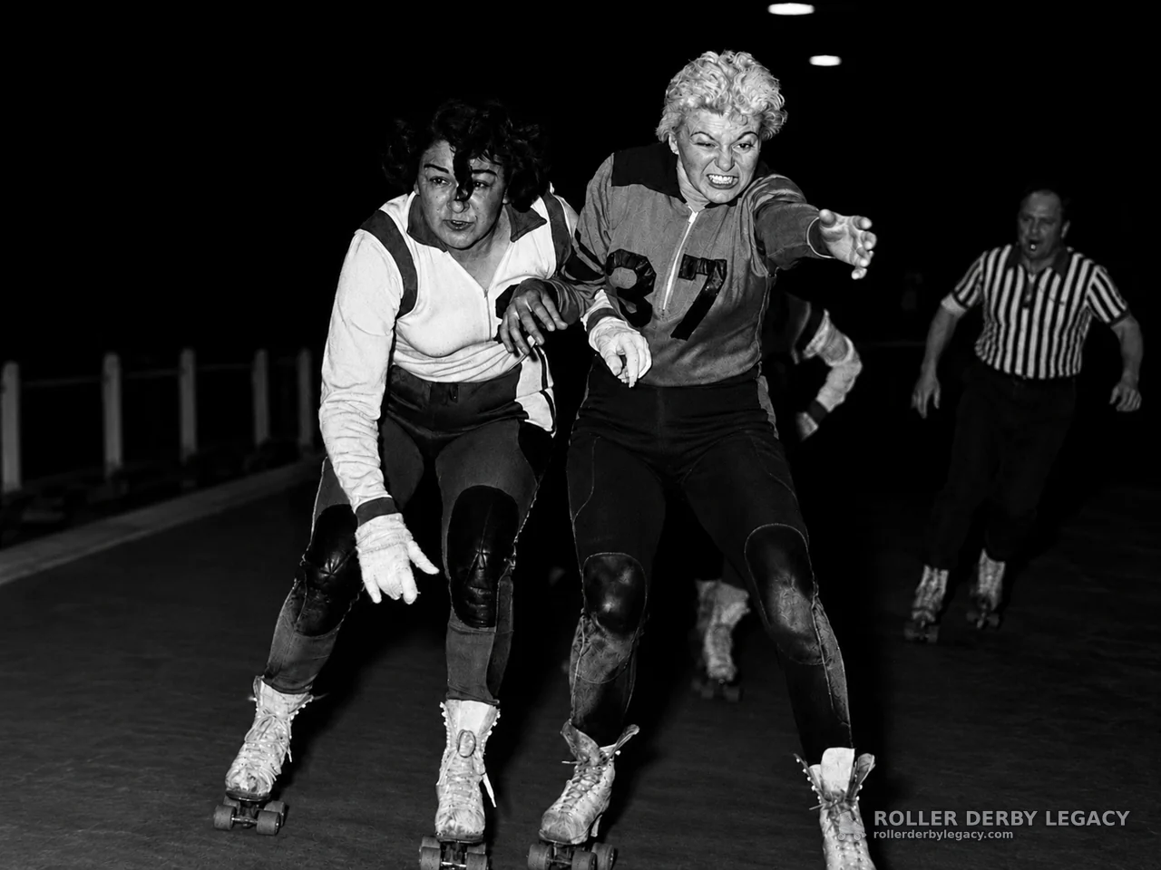 Roller Derby Skaters in Indoor Track Action