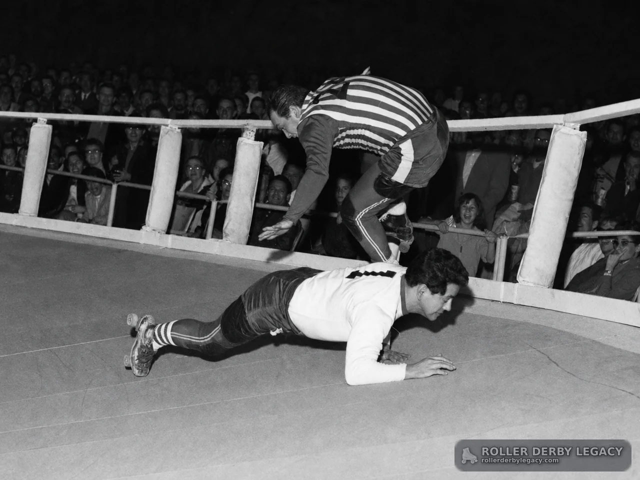 Skater Leaps Over Fallen Roller Derby Skater
