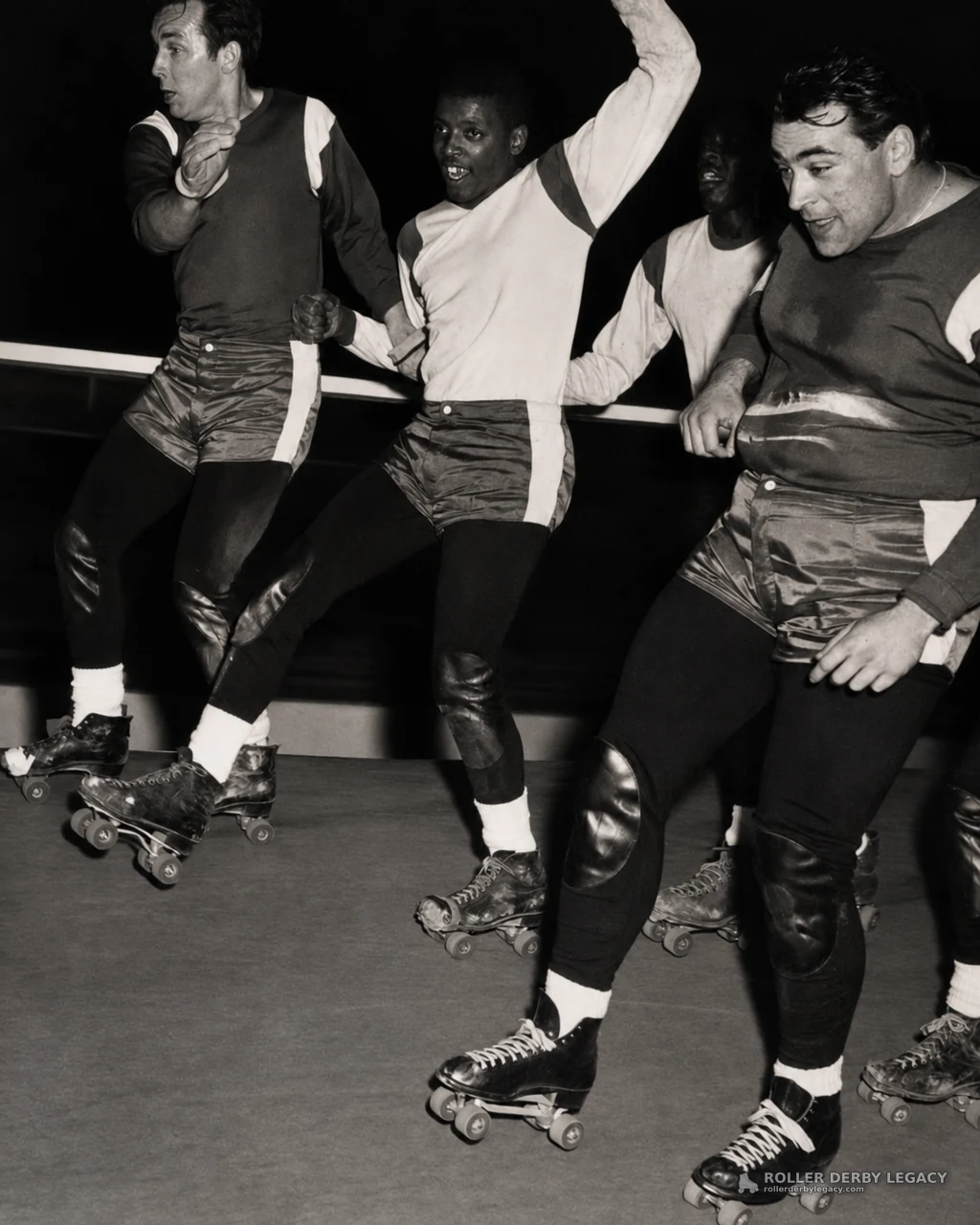 Four Uniformed Roller Skaters in Close Track Action