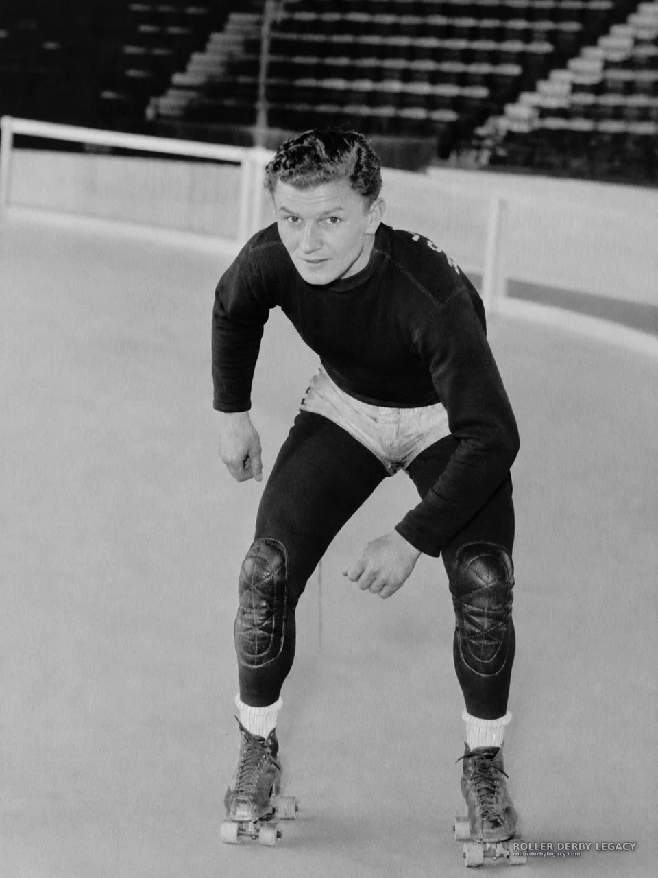 Roller Skater Crouched on an Indoor Rink