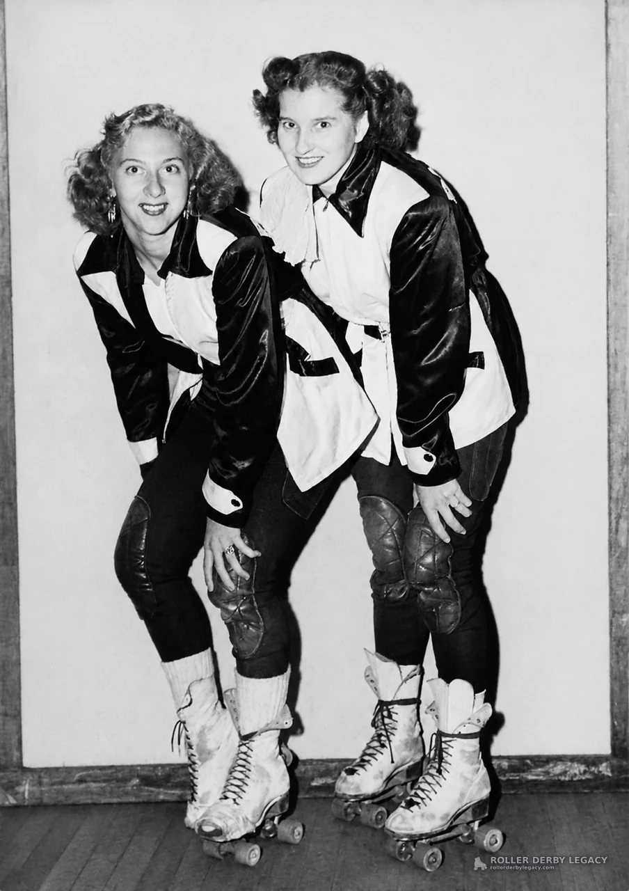 Two Roller Skaters in Matching Uniforms