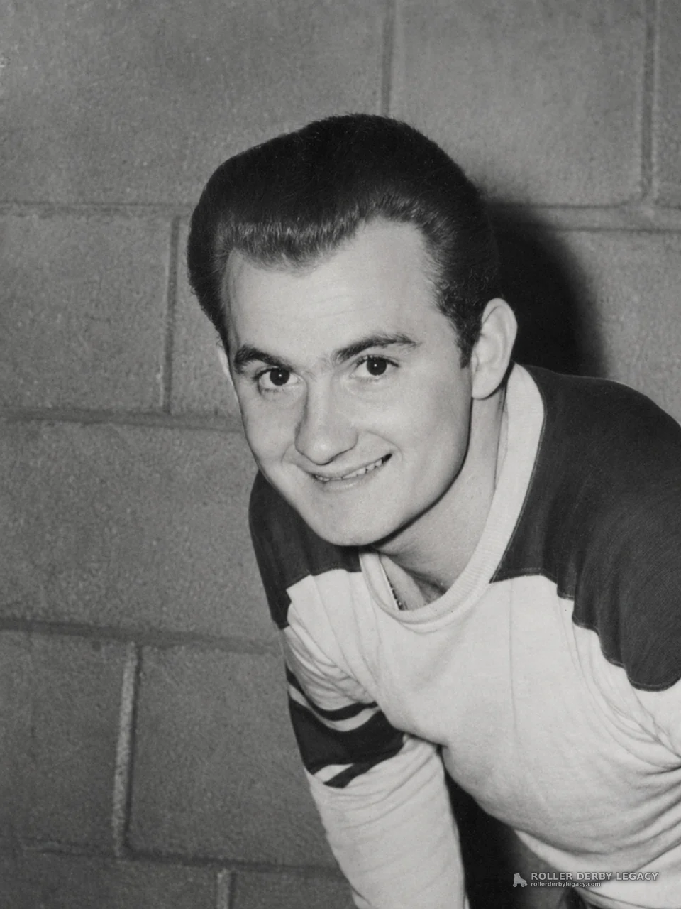 Smiling Skater Portrait Against Cinder Block Wall