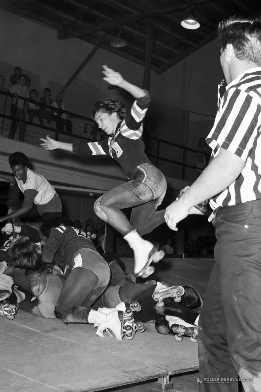 Roller Derby Skater Leaps Over a Track Pileup