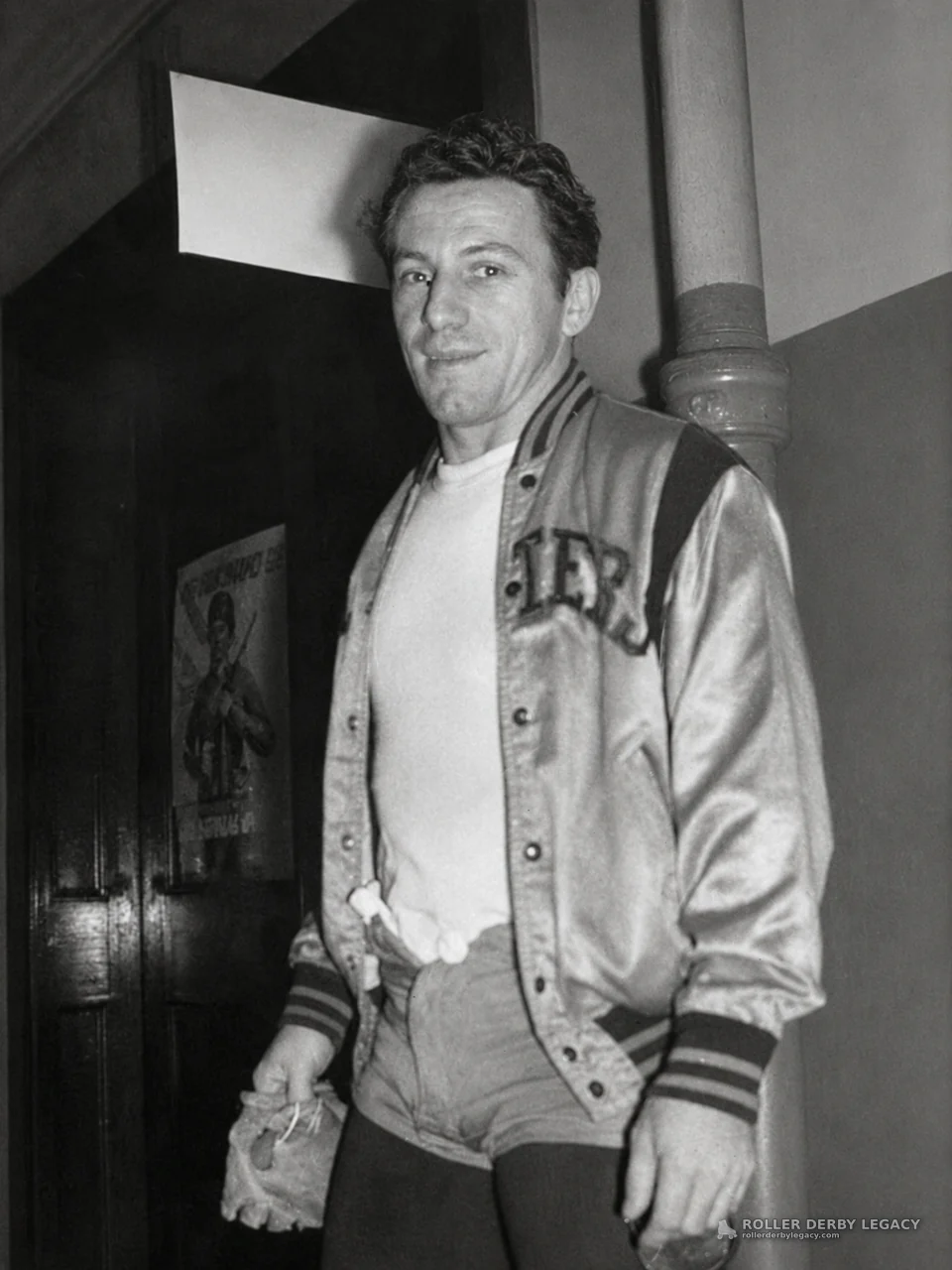 Man in Satin Jacket in an Indoor Hallway
