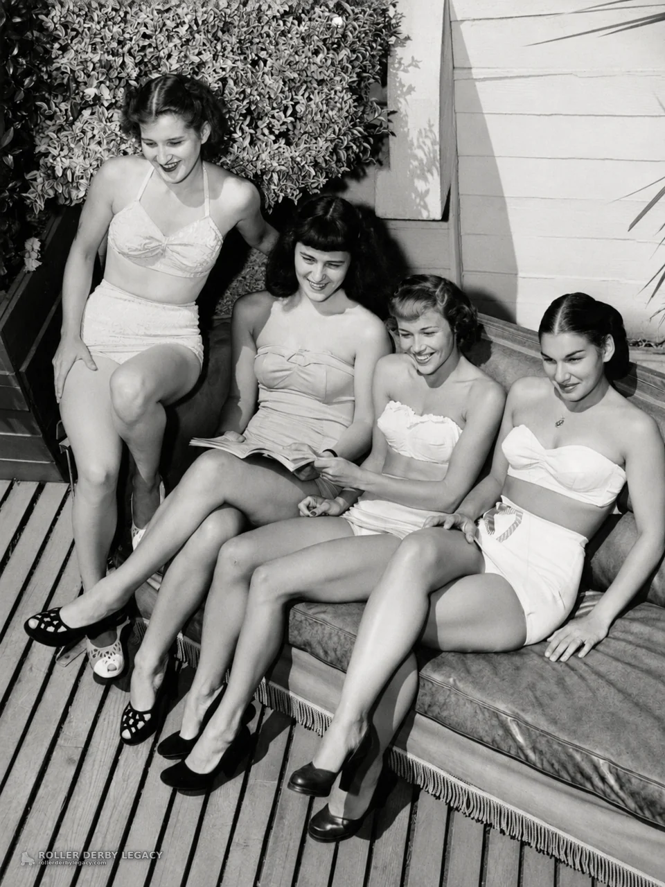 Four Women in Swimwear Reading Outdoors