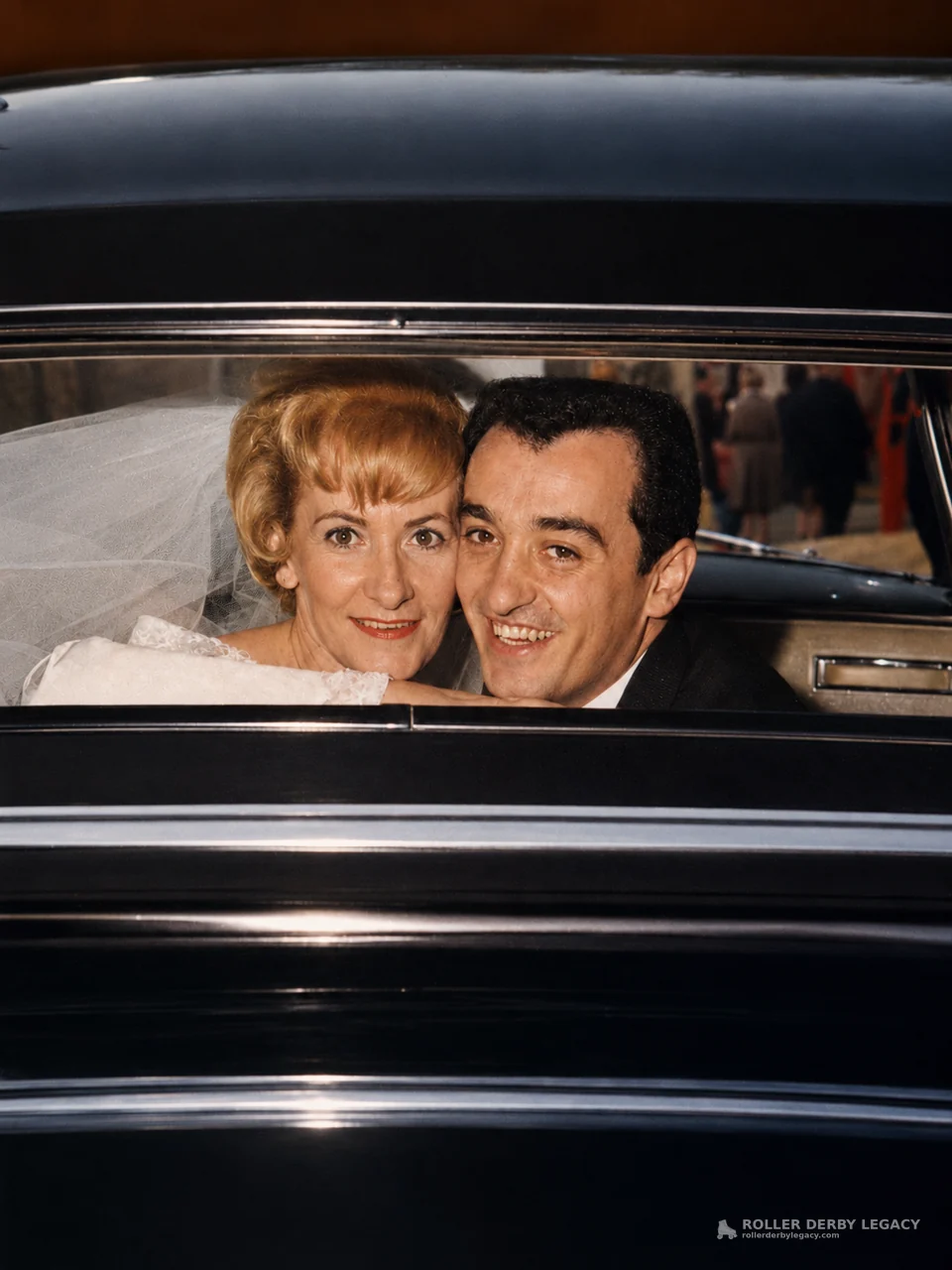 Wedding Couple Seen Through a Car Window