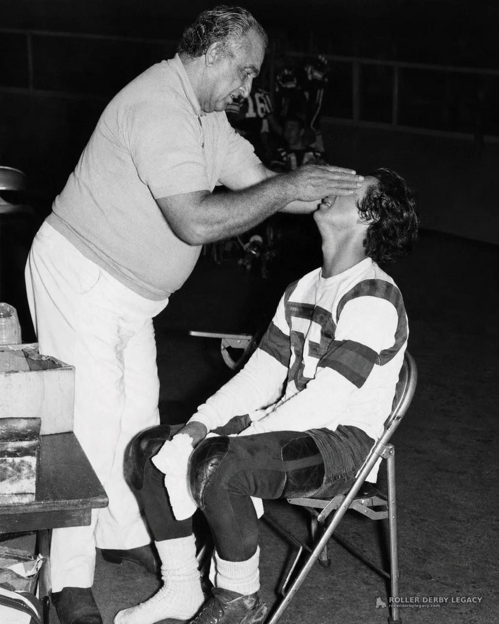 Seated Roller Derby Skater Examined Trackside