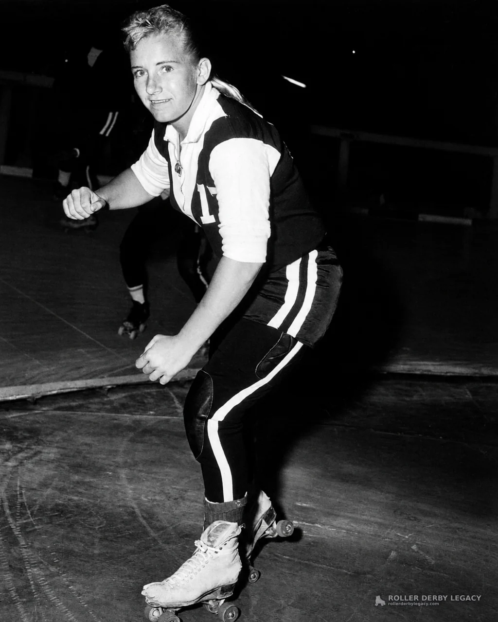Unidentified Skater Wearing Number 1 in an Indoor Rink