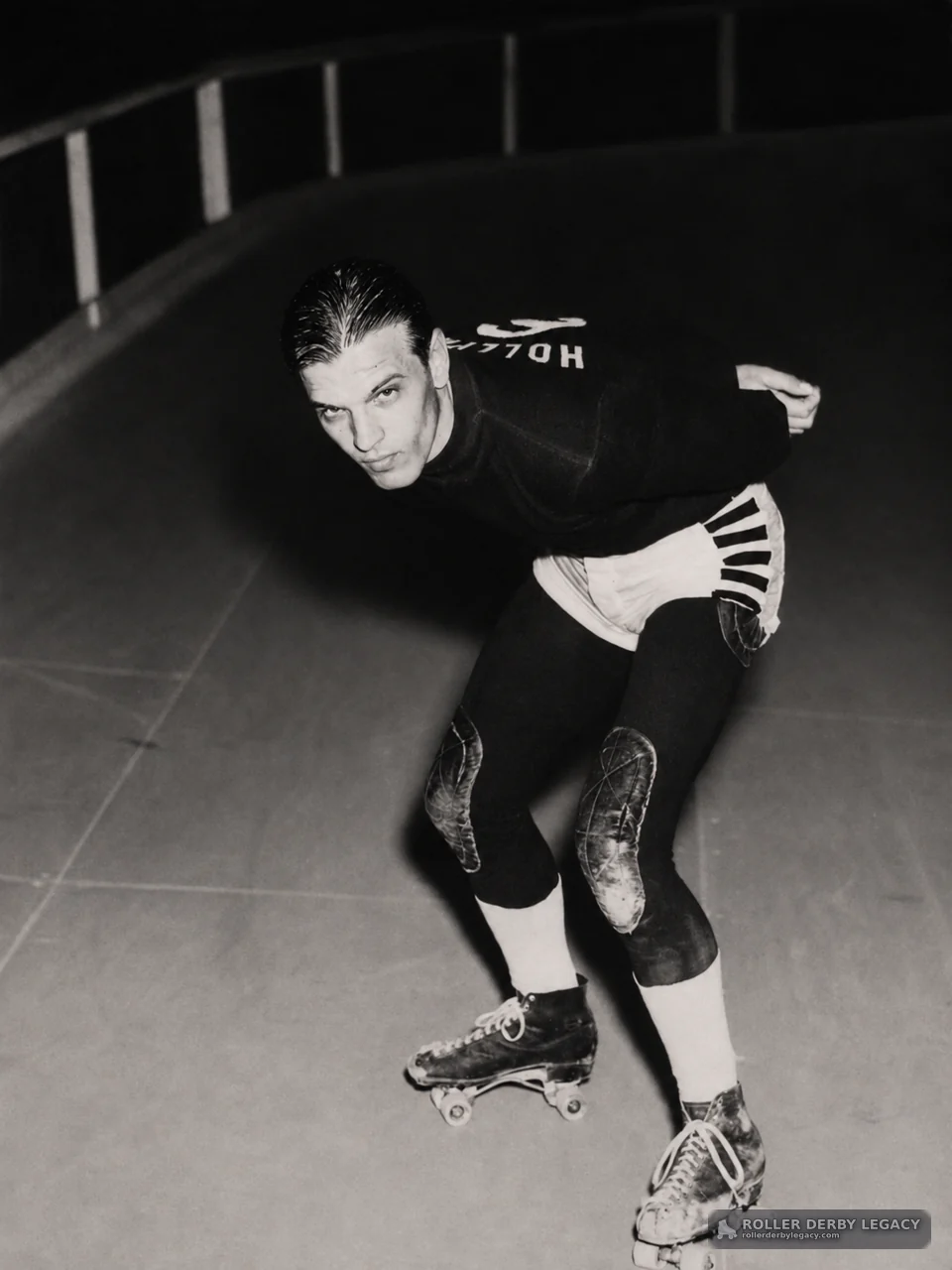 Roller Skater in Racing Stance on Curved Track