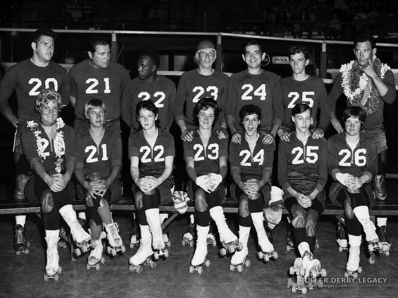 Numbered Roller Skaters Posed in an Indoor Arena