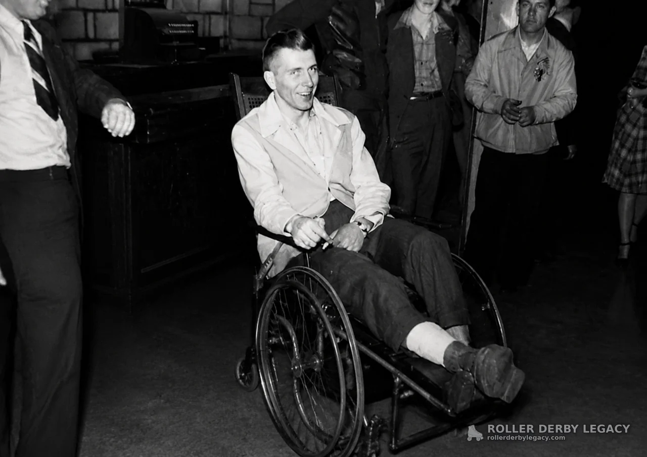 Man in Wheelchair Surrounded by Indoor Group