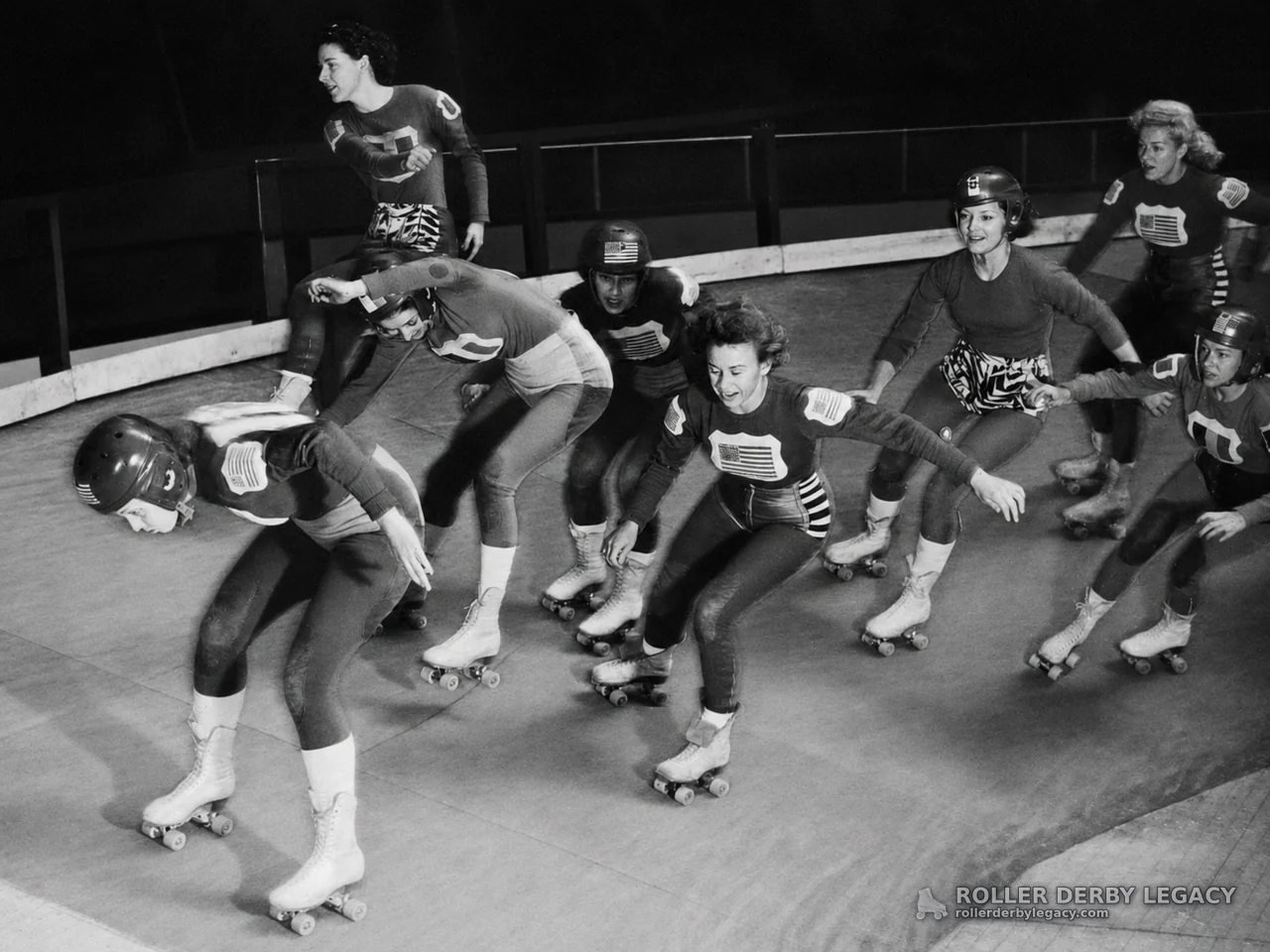 Roller Derby Skaters in Action on an Indoor Track
