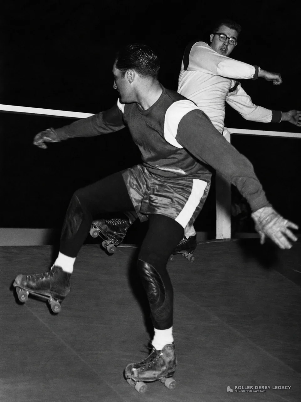 Two Skaters in Close Rink Action