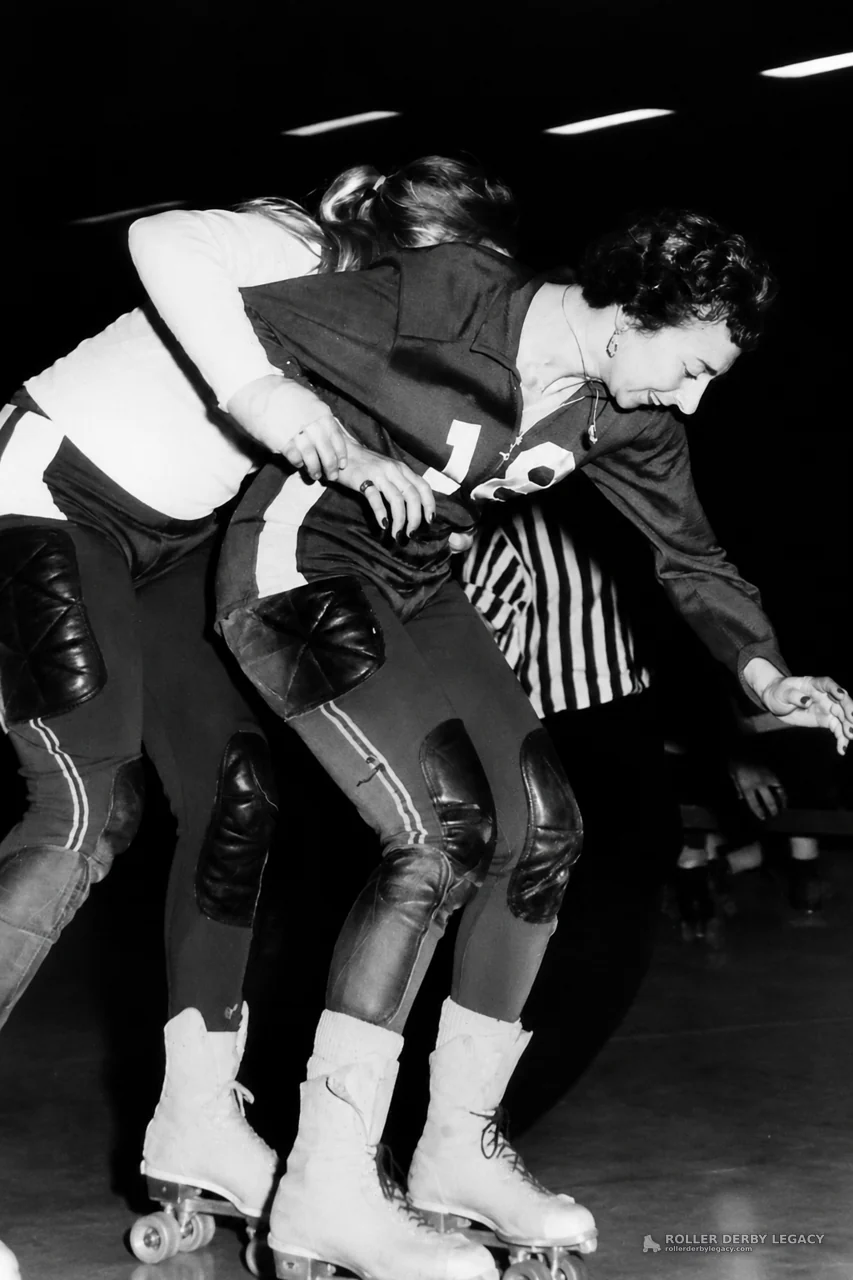 Roller Derby Collision with Striped-Shirt Official